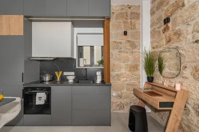 a kitchen with a sink and a counter top at 'Green & Blue' Castella Luxury Suites in Piraeus
