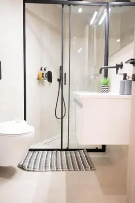 a bathroom with a shower and a toilet and a sink at Sweet Family Home 1 in Athens