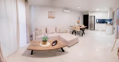a living room with a couch and a table at Sweet Family Home 1 in Athens