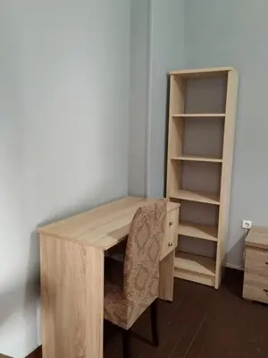 a wooden desk with a chair and a book shelf at Apartment Atiki metro shared bathroom and kitchen in Athens