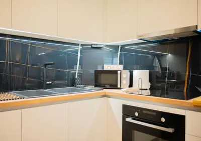 a kitchen with a sink and a microwave at Sweet Family Home 3 in Athens