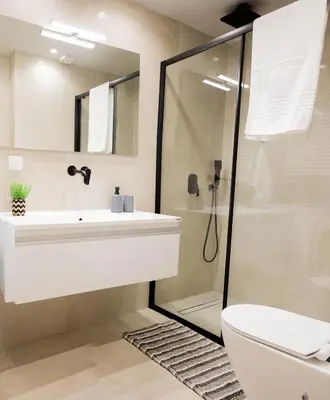 a bathroom with a sink and a shower at Sweet Family Home 2 in Athens