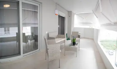 a dining room with a table and chairs and a window at Sweet Family Home 2 in Athens