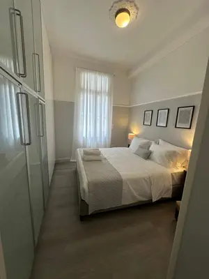 a bedroom with a large bed and a window at elan RESIDENCE in Athens