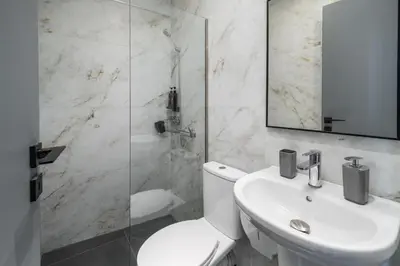 a bathroom with a toilet and a sink and a shower at Ermou Boutique Studios in Monastiraki in Athens