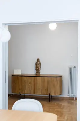 a dining room with a table and two chairs at Unbeatable Acropolis Elegant 2-Bedroom Apartment on Areopagitou in Athens