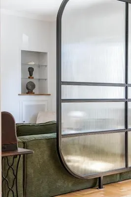 a glass partition in a room with a bed at Unbeatable Acropolis Elegant 2-Bedroom Apartment on Areopagitou in Athens