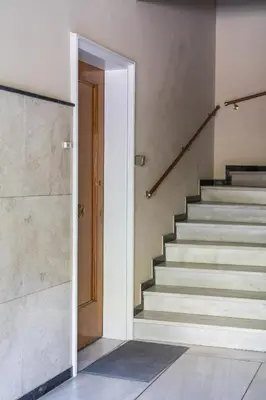 an open door leading to a staircase in a house at Unbeatable Acropolis Elegant 2-Bedroom Apartment on Areopagitou in Athens
