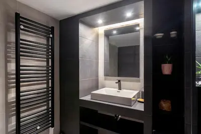 a bathroom with a sink and a mirror at Athens Charm Meets Contemporary Design in Thissio in Athens