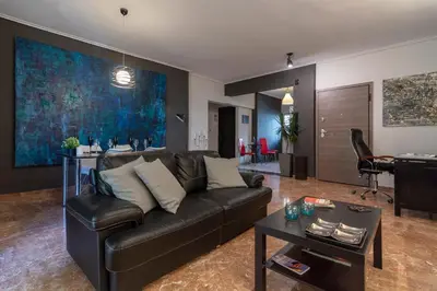 a living room with a couch and a table at Athens Charm Meets Contemporary Design in Thissio in Athens
