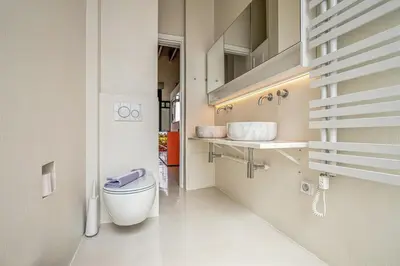 a bathroom with a toilet and a sink at Athens Design Residence in Athens