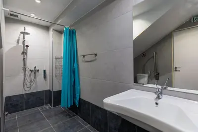 a bathroom with a sink and a shower at Nobia 1 in Athens
