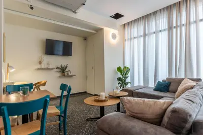 a living room with a couch and a table at Nobia 2 in Athens