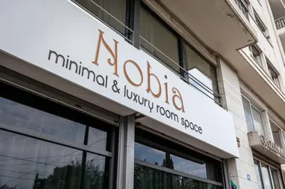 a sign on the side of a building at Nobia 2 in Athens