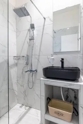 a bathroom with a sink and a shower at Nobia 2 in Athens
