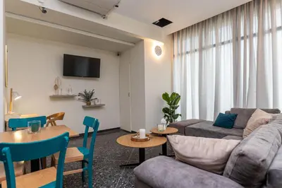 a living room with a couch and a table at Nobia 2 in Athens