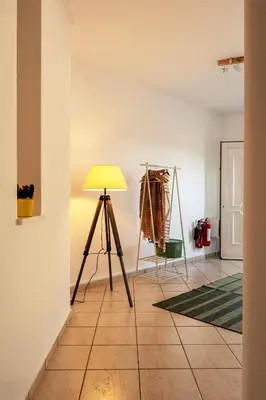 a room with a tripod and a lamp on a tiled floor at Manolia house near beach in Aghia Marina