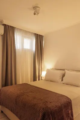 a bedroom with a bed and a window at Manolia house near beach in Aghia Marina