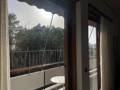 a view of a balcony from a room with a window at aθens flat in Athens