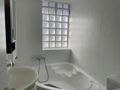 a white bathroom with a tub and a sink at aθens flat in Athens