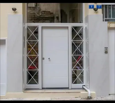 an open door with glass panels in a building at Όνειρα γλυκα in Athens