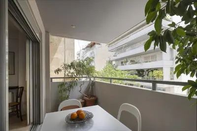 a balcony with a table with oranges on it at Elegant Design Stay in Koukaki in Athens