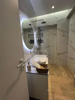 a bathroom with a sink and a mirror at Μοντέρνο στούντιο στην Καλλιθέα in Athens