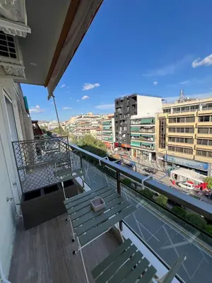 a balcony with benches and a view of a city at Luxury Apartment in Athens in Athens