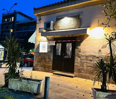 a building with a sign on the front of it at Ben's Penthouse Athens in Athens