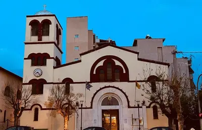 a large white church with a clock tower at Ben's Penthouse Athens in Athens