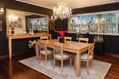 a dining room with a table and chairs at Stunning villa with private pool in Alimos Athens in Athens