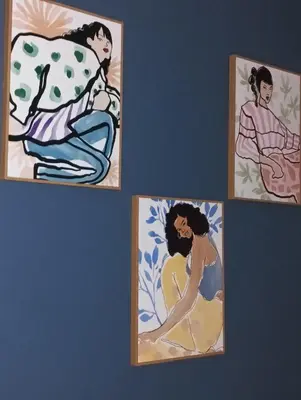 a group of four paintings of a woman on a wall at Urban Pop Athens - City & Culture in Athens