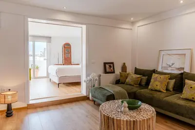 a living room with a couch and a bed at Delimare, Acropolis & Sea View Rooftop, Paleo Faliro in Athens