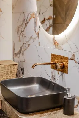 a black sink in a bathroom with a mirror at Delimare, Acropolis & Sea View Rooftop, Paleo Faliro in Athens