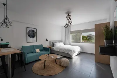 a living room with a couch and a bed at Orion - Stunning Studio in Athens in Athens