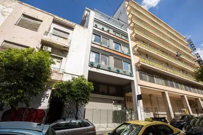 a building with cars parked in front of it at Orion - Stunning Studio in Athens in Athens