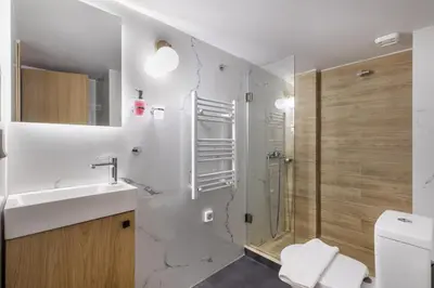 a bathroom with a shower and a sink and a toilet at Orion - Stunning Studio in Athens in Athens