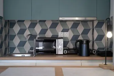 a kitchen counter with a toaster oven and a microwave at Orion - Stunning Studio in Athens in Athens
