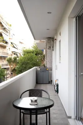a small table and chairs on a balcony at VK Athens Center in Athens