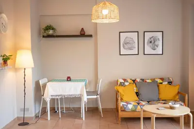 a living room with a couch and a table at VK Athens Center in Athens