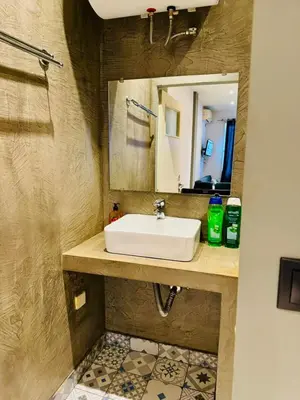a bathroom with a sink and a mirror at Acropolis GrandView in Athens