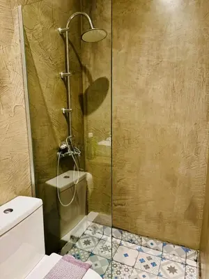 a shower stall in a bathroom with a toilet at Acropolis GrandView in Athens