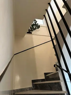 a staircase in a house with a glass floor at Timeless Thissio Home in Athens