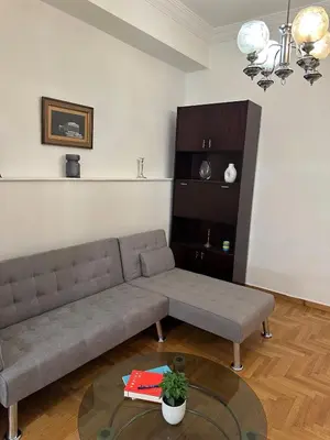 a living room with a couch and a table at Timeless Thissio Home in Athens