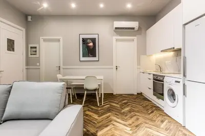 a living room with a couch and a table at Fully Renovated 2bdrm Apartment in Kolonaki area in Athens