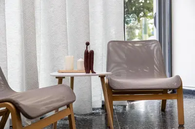 two chairs and a table with two candles on it at Nobia 8 in Athens