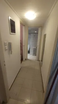 a hallway of a room with a tile floor at Whole Apartment 52 square meters in the neigboor of Pagrati in Athens in Athens