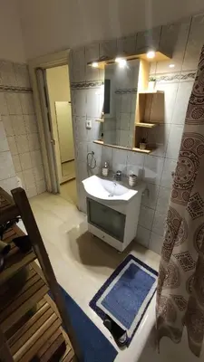 a bathroom with a sink and a mirror at Whole Apartment 52 square meters in the neigboor of Pagrati in Athens in Athens