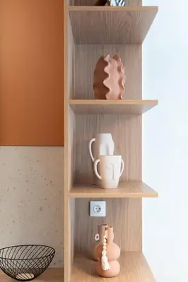 a wooden shelf with cups and other items on it at LIV - Trendy Athenian Apartment in Pagrati in Athens