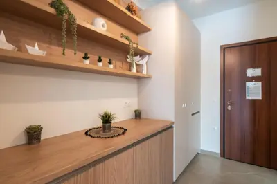 a office with a wooden counter and a door at LIV - Trendy Athenian Apartment in Pagrati in Athens